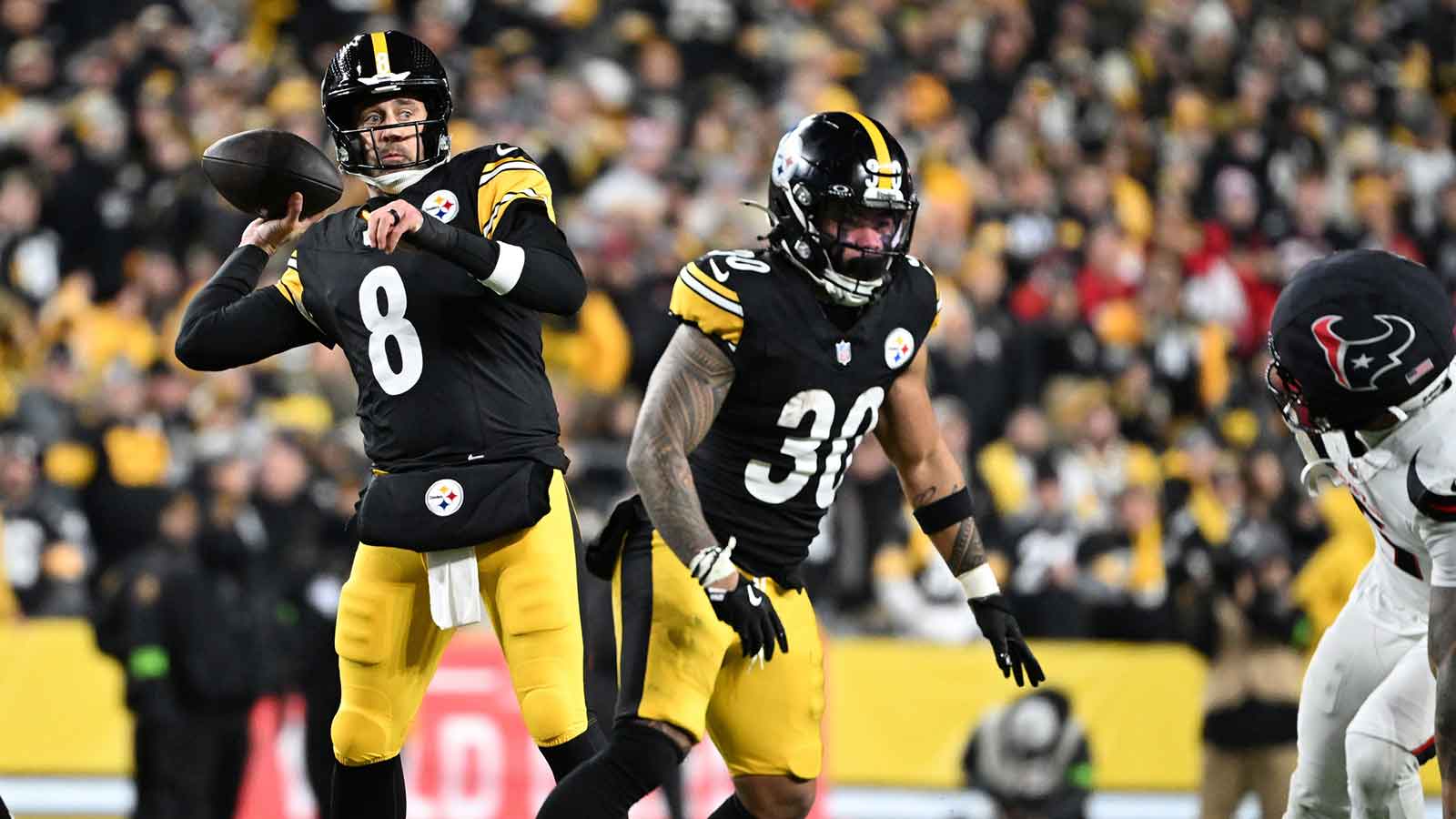 Pittsburgh Steelers quarterback Aaron Rodgers (8) throws during the first half of an AFC Wild Card Round game against the Houston Texans at Acrisure Stadium.