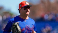 New York Mets right fielder Mike Tauchman (50) returns to the dugout against the Houston Astros during the first inning at Clover Park.