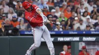 Los Angeles Angels designated hitter Mike Trout (27) hits a single during the third inning against the Houston Astros at Daikin Park