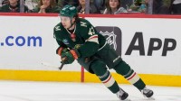 Minnesota Wild defenseman Quinn Hughes (43) plays the puck against the St. Louis Blues in the first period at Grand Casino Arena.