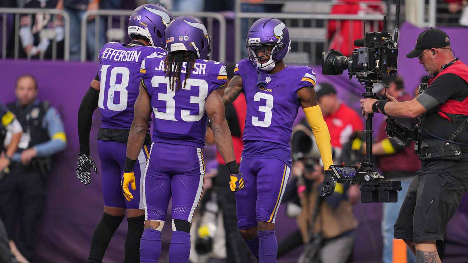 Minnesota Vikings wide receiver Jordan Addison (3) celebrates a touchdown with wide receiver Justin Jefferson (18) and running back Aaron Jones (33) during the fourth quarter against the Chicago Bears at U.S. Bank Stadium.