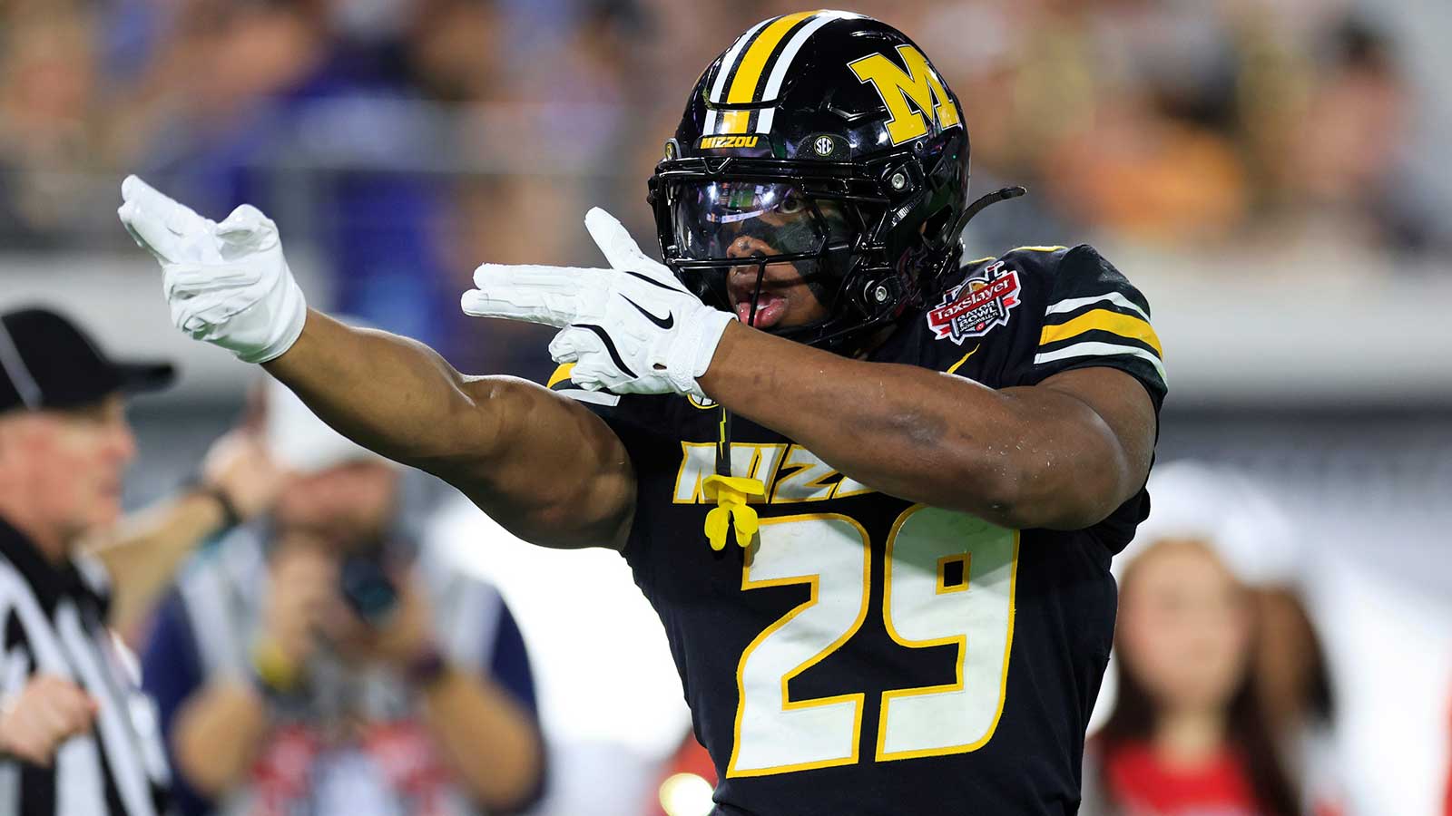 Missouri Tigers running back Ahmad Hardy (29) reacts to his first down pickup during the first quarter of the TaxSlayer Gator Bowl at EverBank Stadium, Saturday, Dec. 27, 2025, in Jacksonville. Fla.