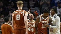 Texas Longhorns guard Brandon Taylor (44) celebrates with center Matas Vokietaitis (8) in the second half against the BYU Cougars during a first round game of the men's 2026 NCAA Tournament at Moda Center. Mandatory Credit: Troy Wayrynen-Imagn Images