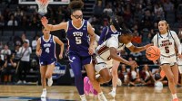 South Carolina Gamecocks guard Ta'niya Latson (00) is fouled by Texas Christian University Horned Frogs guard Olivia Miles (5) during the first quarter in an Elite Eight game in the Sacramento Regional 4 of the women's 2026 NCAA Tournament at the Golden 1 Center.