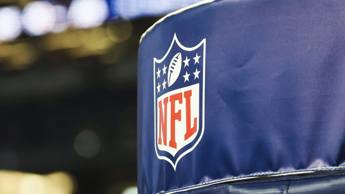 Detail of NFL logo on a goal post pad before a game between the Los Angeles Chargers and Dallas Cowboys at AT&T Stadium.