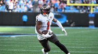 Tampa Bay Buccaneers running back Rachaad White (1) with the ball in the third quarter at Bank of America Stadium.