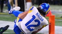 Los Angeles Rams wide receiver Puka Nacua (12) scores a touchdown against the Seattle Seahawks during the second half in the 2026 NFC Championship Game at Lumen Field.