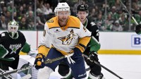 Nashville Predators center Steven Stamkos (91) and Dallas Stars defenseman Esa Lindell (23) chase the puck during the third period at the American Airlines Center.