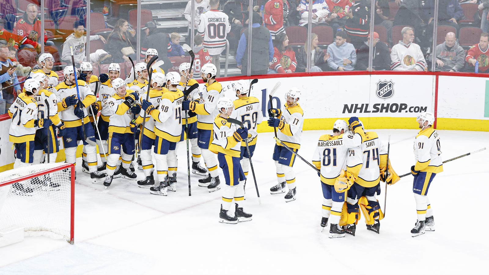 Nashville Predators left wing Filip Forsberg (9) celebrates with teammates after scoring a game winning goal against the Chicago Blackhawks in overtime at United Center.