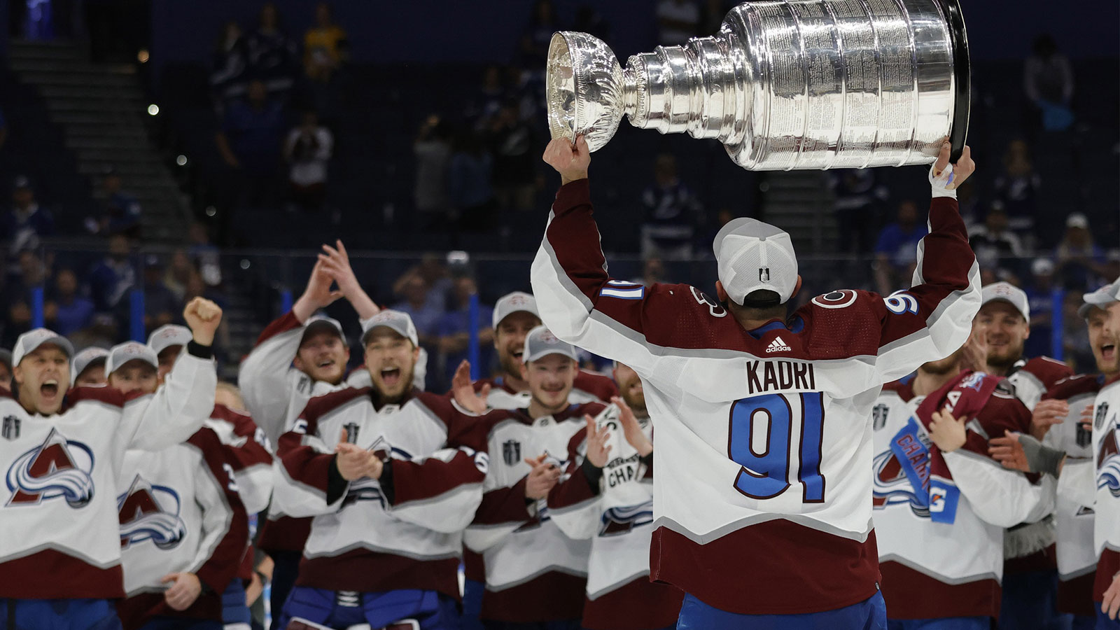 Colorado Avalanche center Nazem Kadri (91) celebrates with the Stanley Cup after the Avalanche game against the Tampa Bay Lightning in game six of the 2022 Stanley Cup Final at Amalie Arena.