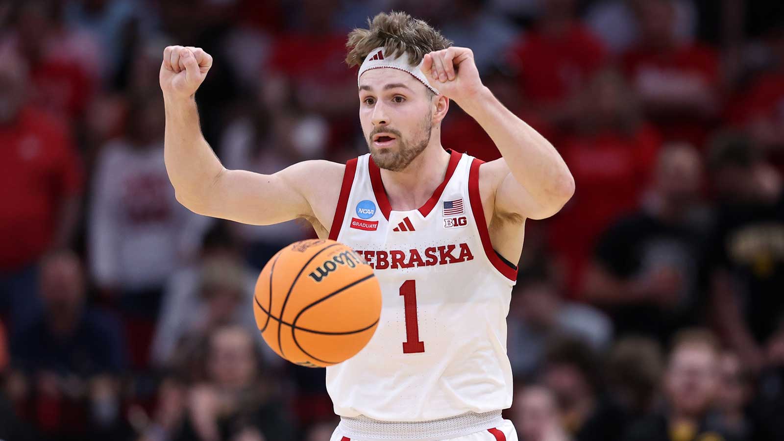 Nebraska Cornhuskers guard Sam Hoiberg (1) reacts while dribbling th ball against the Iowa Hawkeyes in the second half during a Sweet Sixteen game of the South Regional of the men's 2026 NCAA Tournament at Toyota Center.