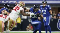 Indianapolis Colts running back Jonathan Taylor (28) carries the ball defended by San Francisco 49ers defensive tackle Jordan Elliott (92) in the third quarter of the game at Lucas Oil Stadium.