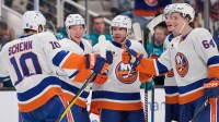 New York Islanders defenseman Tony DeAngelo (77) celebrates with center Brayden Schenn (10), left wing Ondrej Palat (81), defenseman Matthew Schaefer (48) and center Calum Ritchie (64) after scoring a goal against the San Jose Sharks during the first period at SAP Center at San Jose.