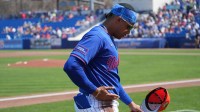 New York Mets right fielder Juan Soto (22) rubs some infield dirt on his pants before the game against the St. Louis Cardinals at Clover Park.