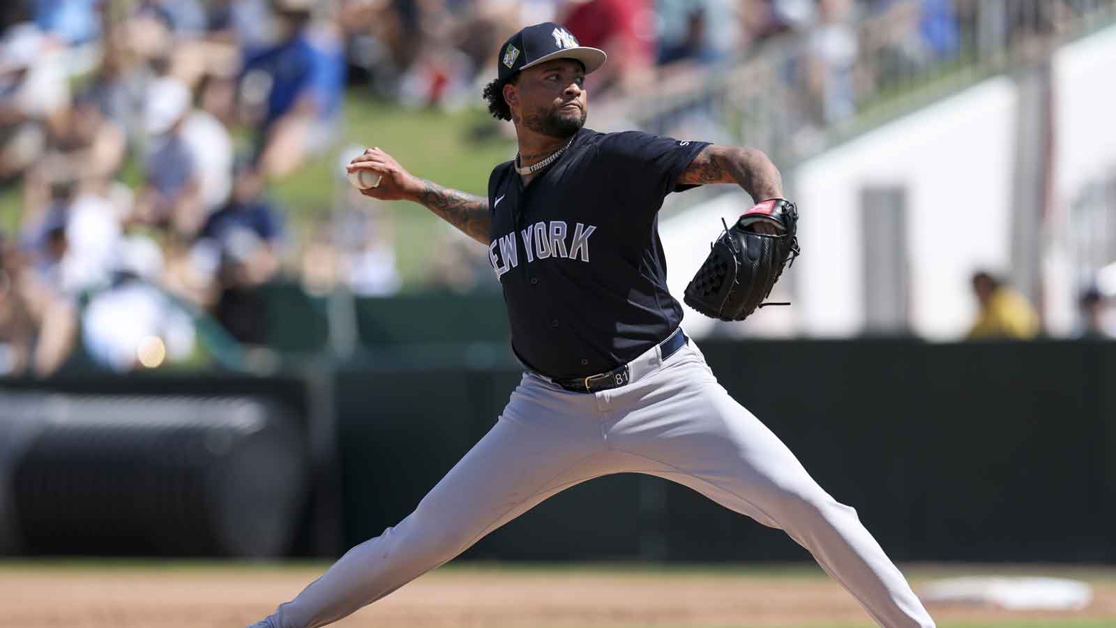 New York Yankees starting pitcher Luis Gil (81) throws a pitch against the Minnesota Twins in the first inning during spring training at Lee Health Sports Complex/Hammond Stadium.