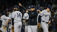 New York Yankees manager Aaron Boone (17) signals for a pitching change during the seventh inning against the Seattle Mariners at T-Mobile Park.