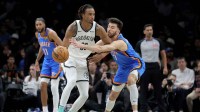 Brooklyn Nets center Nic Claxton (33) controls the ball against Oklahoma City Thunder center Chet Holmgren (7) during the second quarter at Barclays Center.
