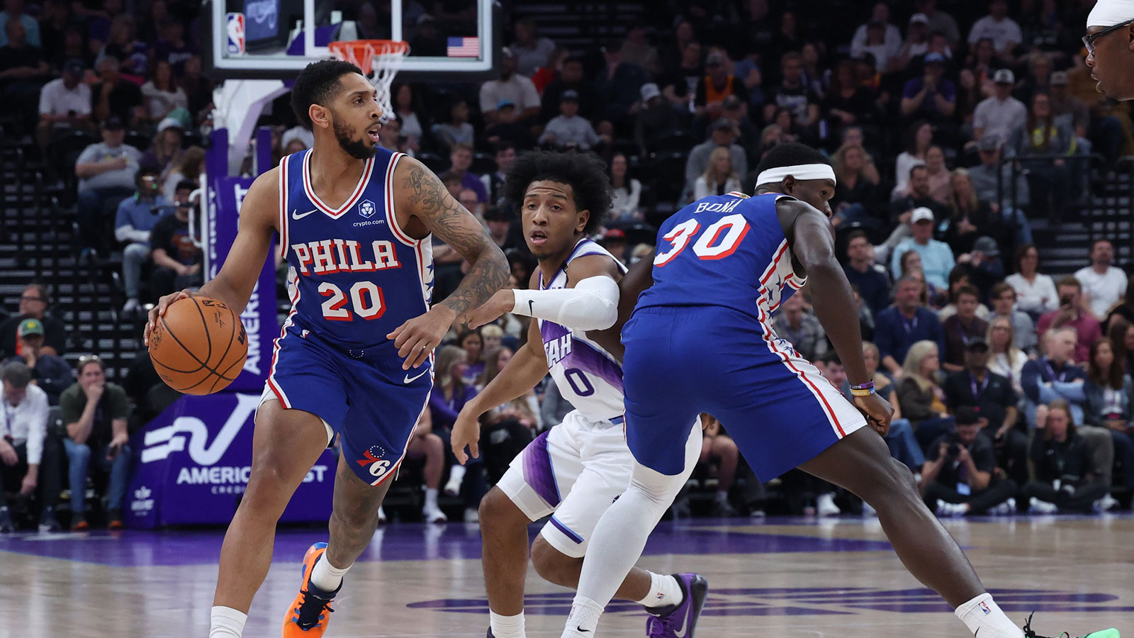 Philadelphia 76ers guard Cameron Payne (20) uses a screen by center Adem Bona (30) to move the ball against Utah Jazz guard Kennedy Chandler (0) during the first half at Delta Center.