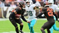 Miami Dolphins wide receiver Nick Westbrook-Ikhine (18) tries to tackle Cleveland Browns safety Ronnie Hickman Jr. (33) after Hickman intercepted a pass during the second half at Huntington Bank Field.