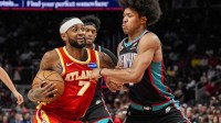 Atlanta Hawks guard Nickeil Alexander-Walker (7) tries to get to the basket against Memphis Grizzlies forward Jaylen Wells (0) during the second half at State Farm Arena.