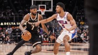 Atlanta Hawks guard Nickeil Alexander-Walker (7) dribbles against Philadelphia 76ers guard Quentin Grimes (5) during the second half at State Farm Arena.