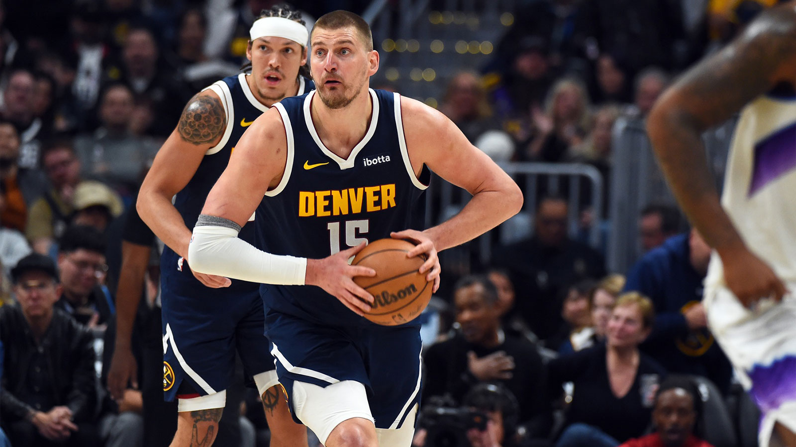Denver Nuggets center Nikola Jokic (15) passes the ball up the floor after a rebound during the second half against the Utah Jazz at Ball Arena.
