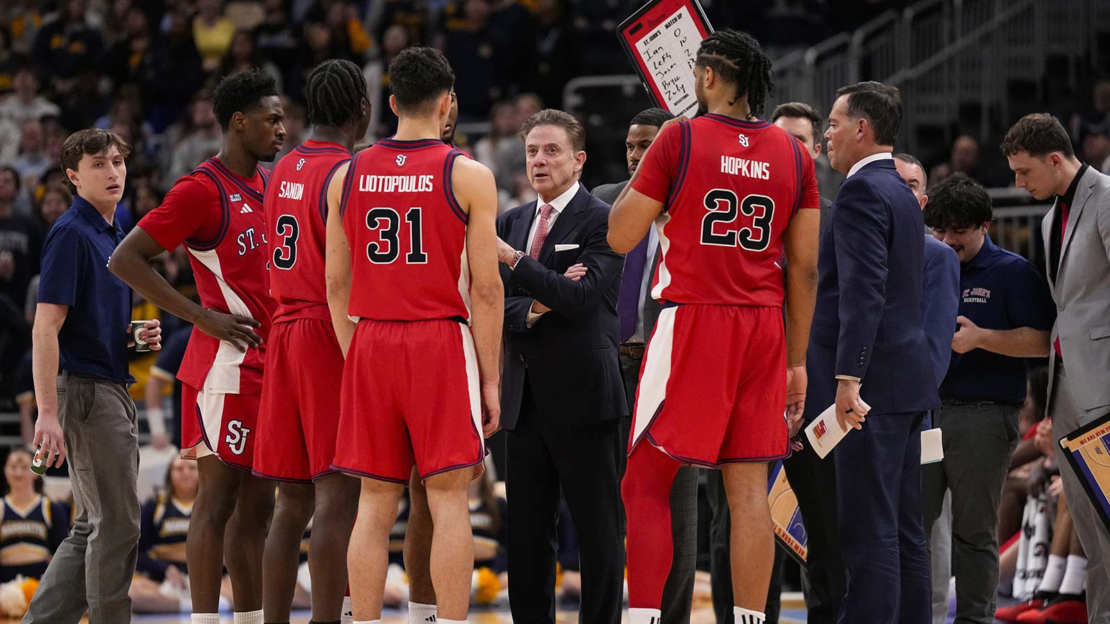 St. John's Red Storm head coach Rick Pitino talks to players during a time out during the first half against the Marquette Golden Eagles at Fiserv Forum.