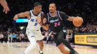 Miami Heat guard Norman Powell (24) drives to the basket as Orlando Magic forward Jamal Cain (8) defends during the second half at Kaseya Center.