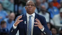 North Carolina Tar Heels head coach Hubert Davis instructs his team against the VCU Rams in the first half of a first round game of the men's 2026 NCAA Tournament at Bon Secours Wellness Arena.
