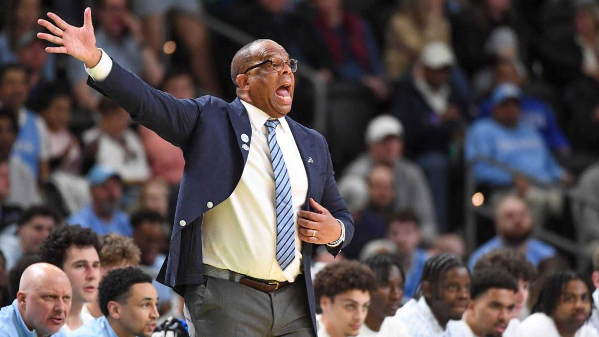 North Carolina Tar Heels head coach Hubert Davis yells down court.