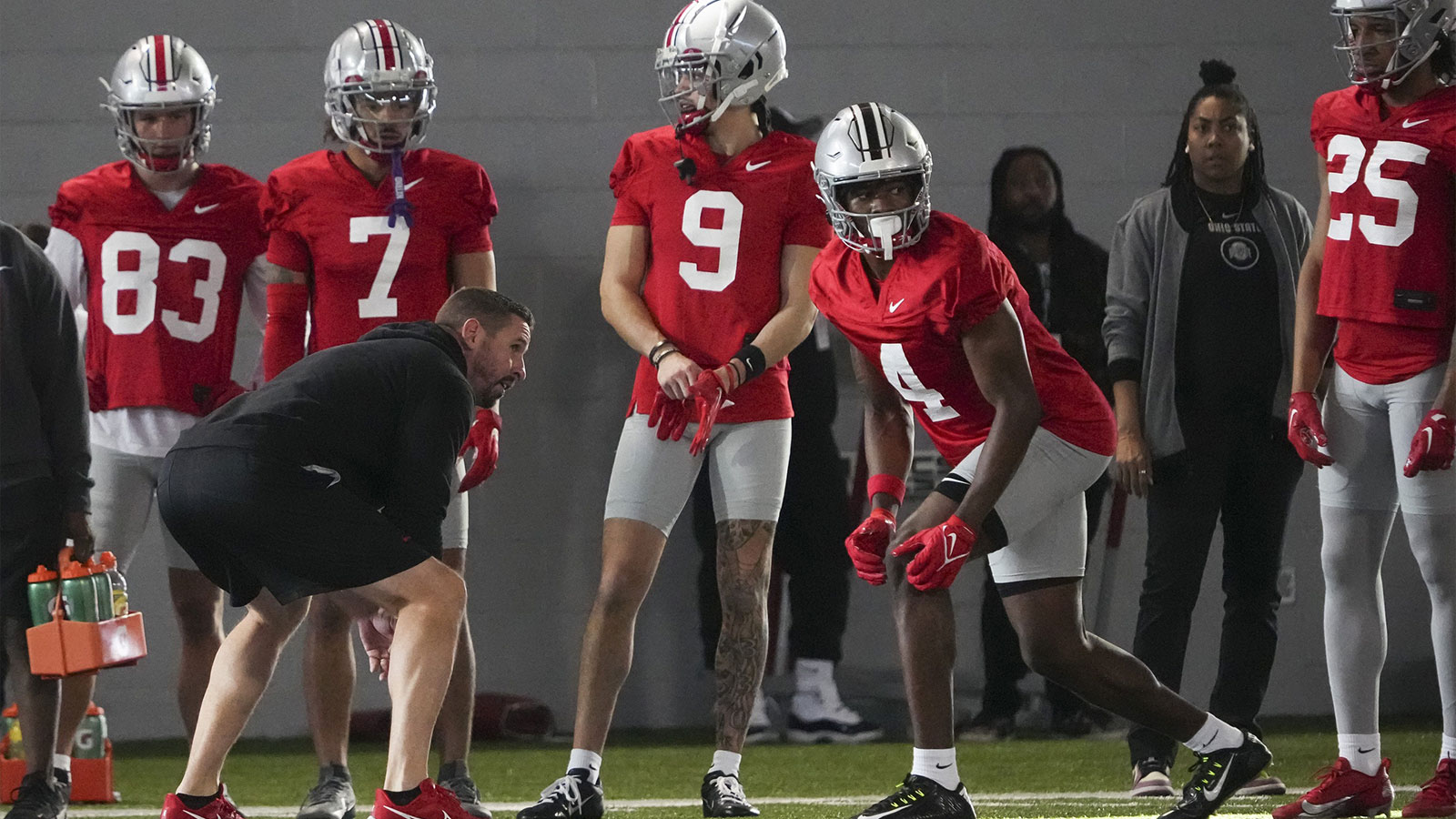 Mar 5, 2024; Columbus, OH, USA; Ohio State Buckeyes offensive coordinator Brian Hartline lines up beside wide receiver Jeremiah Smith (4) during the first spring practice at the Woody Hayes Athletic Center.