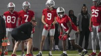 Mar 5, 2024; Columbus, OH, USA; Ohio State Buckeyes offensive coordinator Brian Hartline lines up beside wide receiver Jeremiah Smith (4) during the first spring practice at the Woody Hayes Athletic Center.