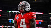 Ohio State Buckeyes wide receiver Jeremiah Smith (4) celebrates after he runs for a touchdown during the 2025 Cotton Bowl and quarterfinal game of the College Football Playoff at AT&T Stadium.