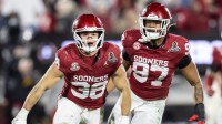 Oklahoma Sooners linebacker Owen Heinecke (38) and defensive lineman Marvin Jones Jr. (97) against the Alabama Crimson Tide during the CFP National Playoff First Round at Gaylord Family Oklahoma Memorial Stadium.