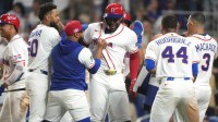 Dominican Republic center fielder Oneil Cruz (15) celebrates his three-run home run in the eighth inning against Nicaragua with teammates at loanDepot Park.