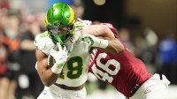 Oregon Ducks tight end Kenyon Sadiq (18) runs against Indiana Hoosiers linebacker Isaiah Jones (46)during the first quarter of the 2025 Peach Bowl and semifinal game of the College Football Playoff at Mercedes-Benz Stadium.