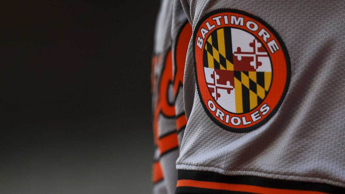 The Baltimore Orioles logo on the sleeve of designated hitter Gunnar Henderson (2) as he prepares on deck during the seventh inning against the Cincinnati Reds at Great American Ball Park.