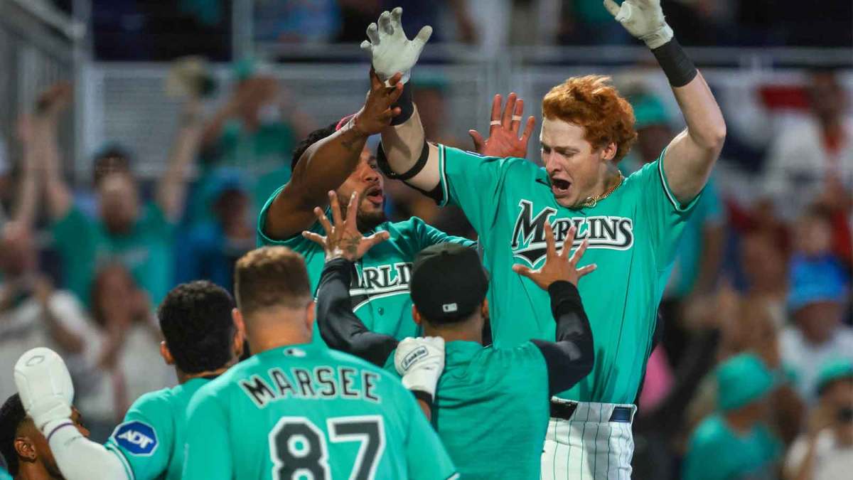 Miami Marlins right fielder Owen Caissie (17) celebrates with teammates after hitting a two-run walk-off home run against the Colorado Rockies during the ninth inning at loanDepot Park.