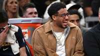 Pacers Tyrese Haliburton laughs on the bench during the first quarter against the Los Angeles Lakers at Gainbridge Fieldhouse