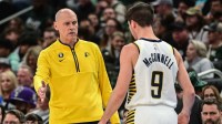 Pacers head coach Rick Carlisle talks to guard T.J. McConnell