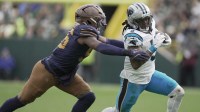 Green Bay Packers' Edgerrin Cooper (56) pursues Carolina Panthers running back Rico Dowdle (5) during the third quarter of their game at Lambeau Field.