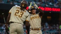 Padres left fielder Juan Soto (22) celebrates with right fielder Fernando Tatis Jr.