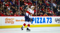 Florida Panthers left wing A.J. Greer (10) gets injected from the game during the third period against the Calgary Flames at Scotiabank Saddledome.