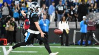 Carolina Panthers punter Sam Martin (6) punts in the fourth quarter in an NFC Wild Card Round game at Bank of America Stadium.