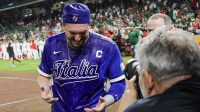 Italy first baseman Vinnie Pasquantino (9) gets a water bath after defeating Mexico at Daikin Park.