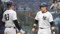 New York Yankees first base Ben Rice (22) celebrates with Paul Goldschmidt (48) after scoring a run against the San Francisco Giants during the fifth inning at Yankee Stadium.
