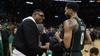 Boston Celtics forward Jayson Tatum (0) talks with former Celtics great Paul Pierce after they defeated the Philadelphia 76ers at TD Garden.