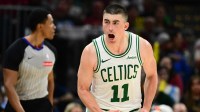 Boston Celtics guard Payton Pritchard (11) celebrates after hitting a three point basket against the Cleveland Cavaliers during the second half at Rocket Arena.