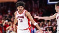 Arizona Wildcats forward Koa Peat (10) celebrates during the first half of the game against the Kansas Jayhawks at McKale Memorial Center.