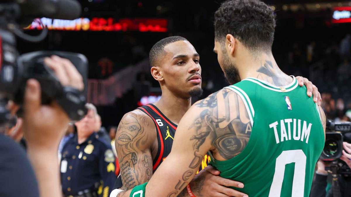 Pelicans' Dejounte Murray talks to Celtics' Jayson Tatum
